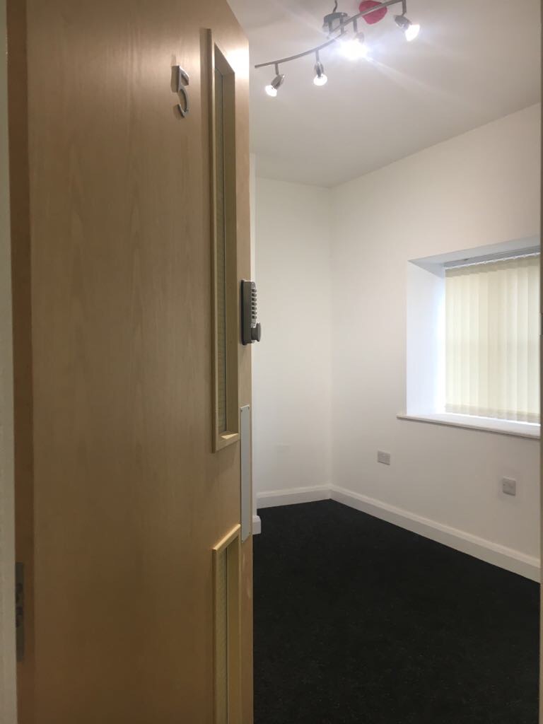 Office viewed through an open doorway